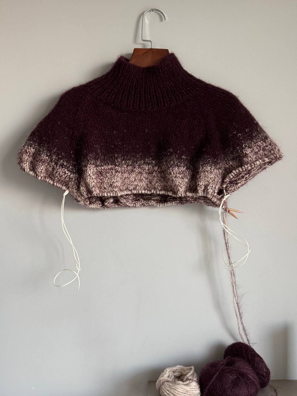 High neck pullover with gradient knitting techniques.