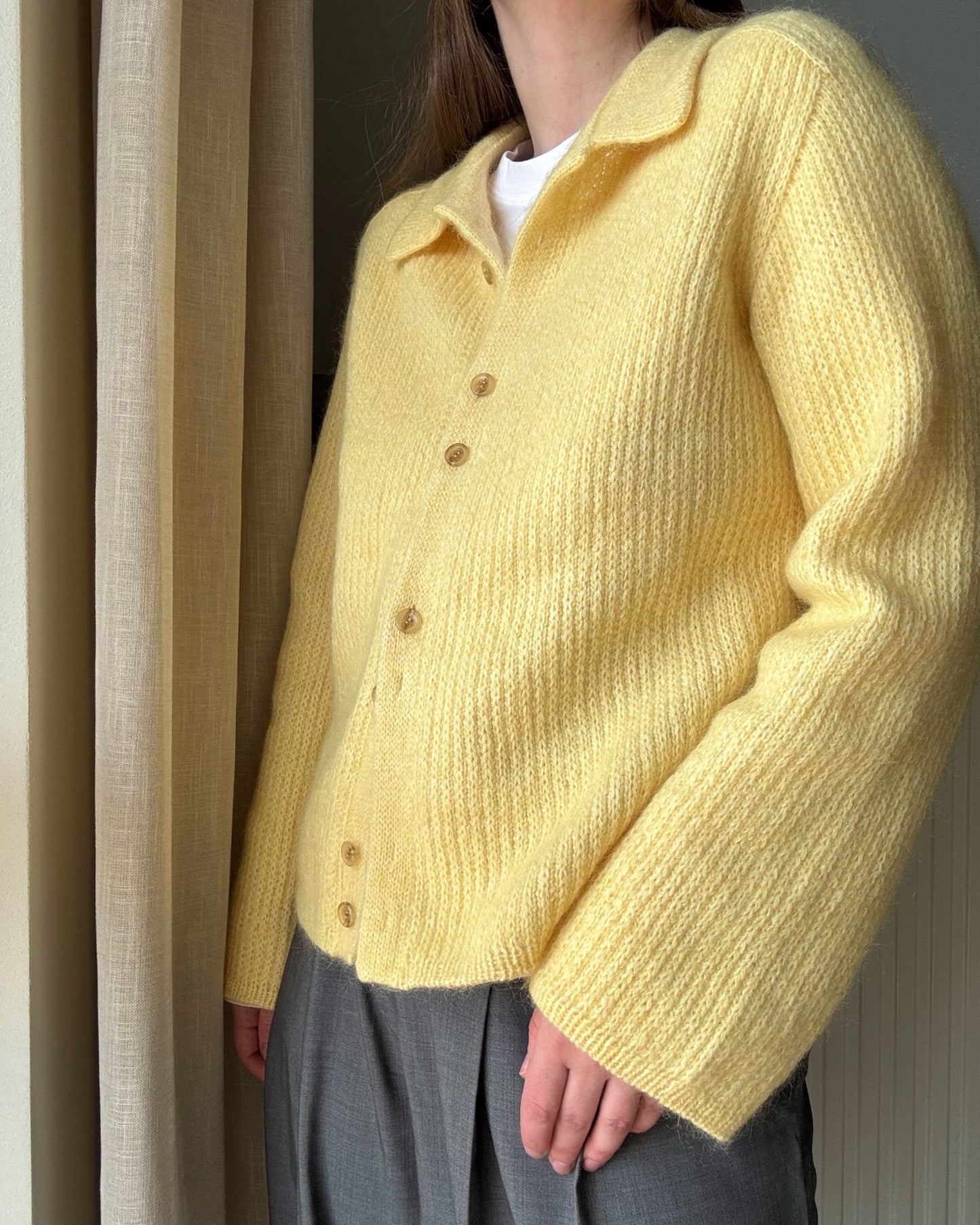 Lifestyle image of feminine modern Chantal Collar Cardigan pattern styled for womens knitwear wardrobe inspiration.