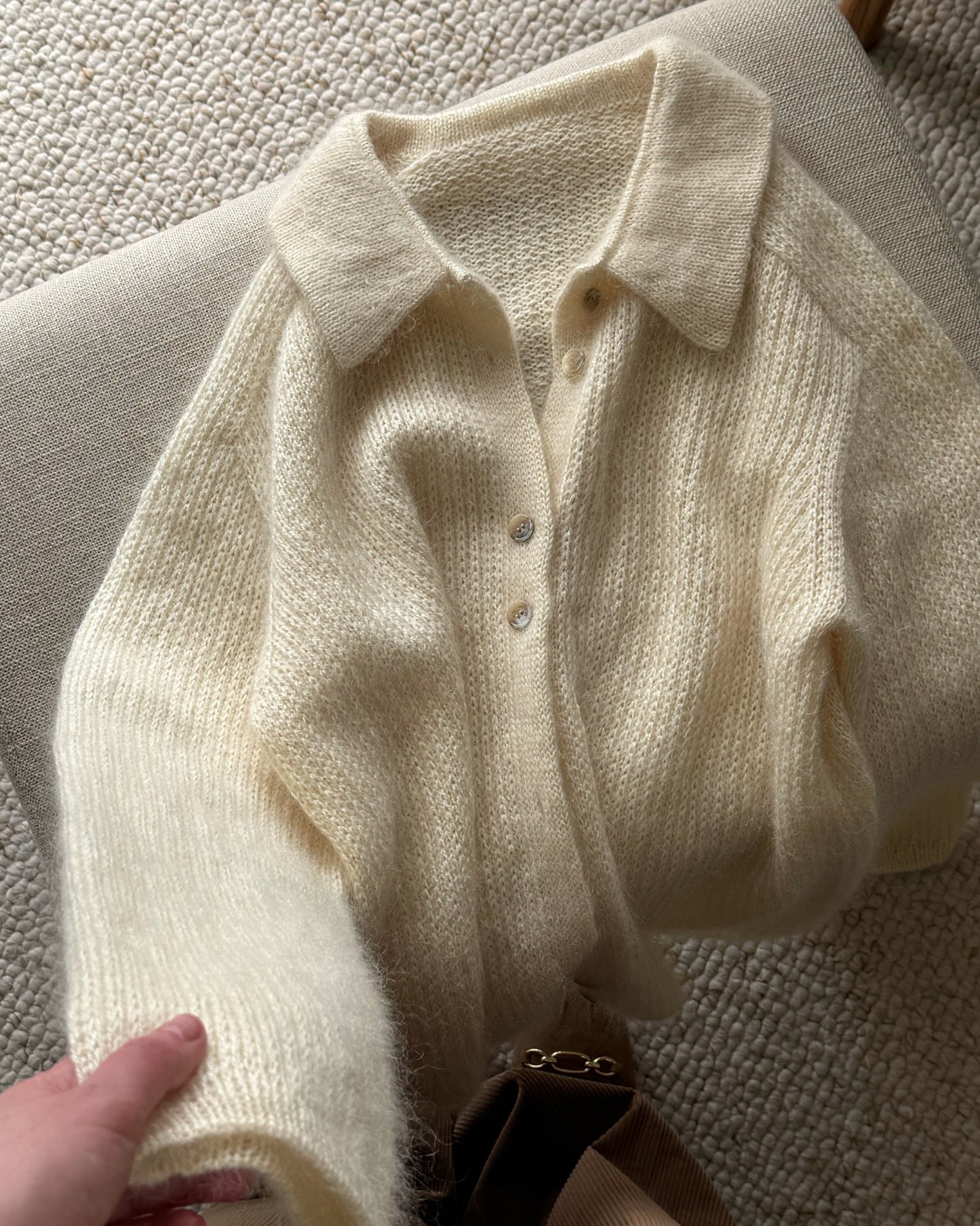 Professional studio image emphasizing button up front and elegance of Chantal Collar Cardigan expert pattern.
