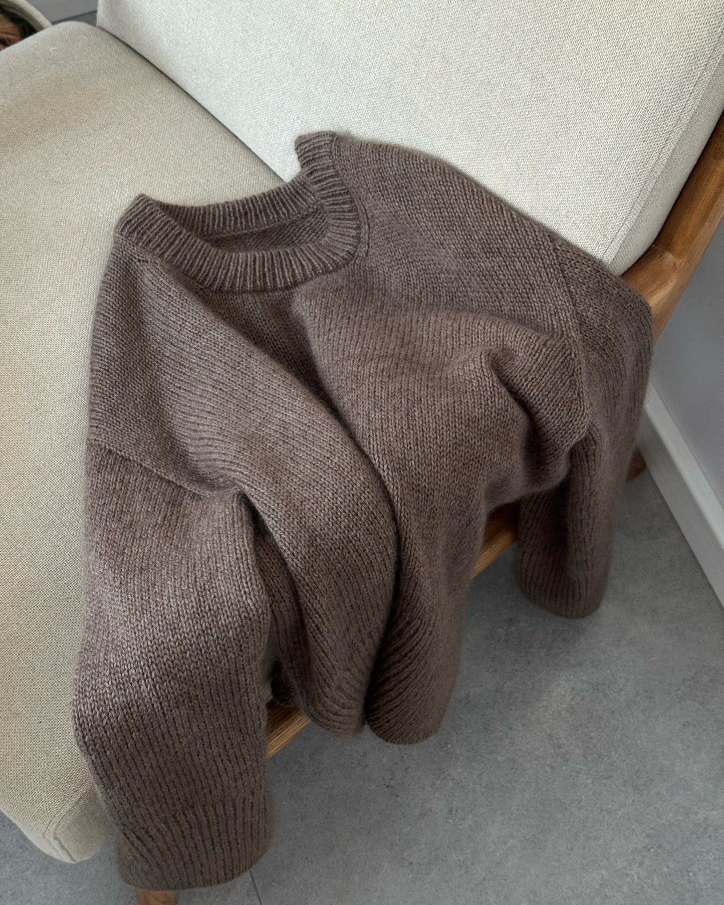 Scandinavian style photo of Ciro Sweater oversized top down crewneck in stockinette stitch on designer by Moreca Knit.
