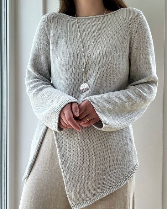 Liv Blouse displayed flat shows modern boatneck and asymmetrical top down construction in regular fit cotton linen silk fabric.