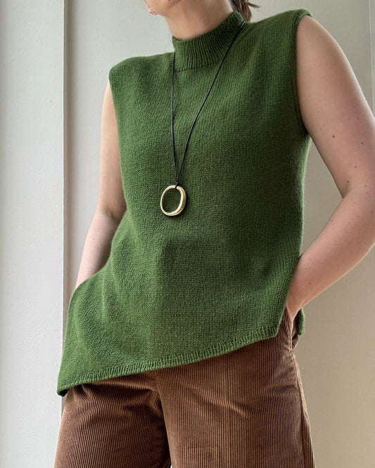 Liv Top displayed flat shows modern sleeveless crewneck worked top down in cashmere stockinette for regular fit.