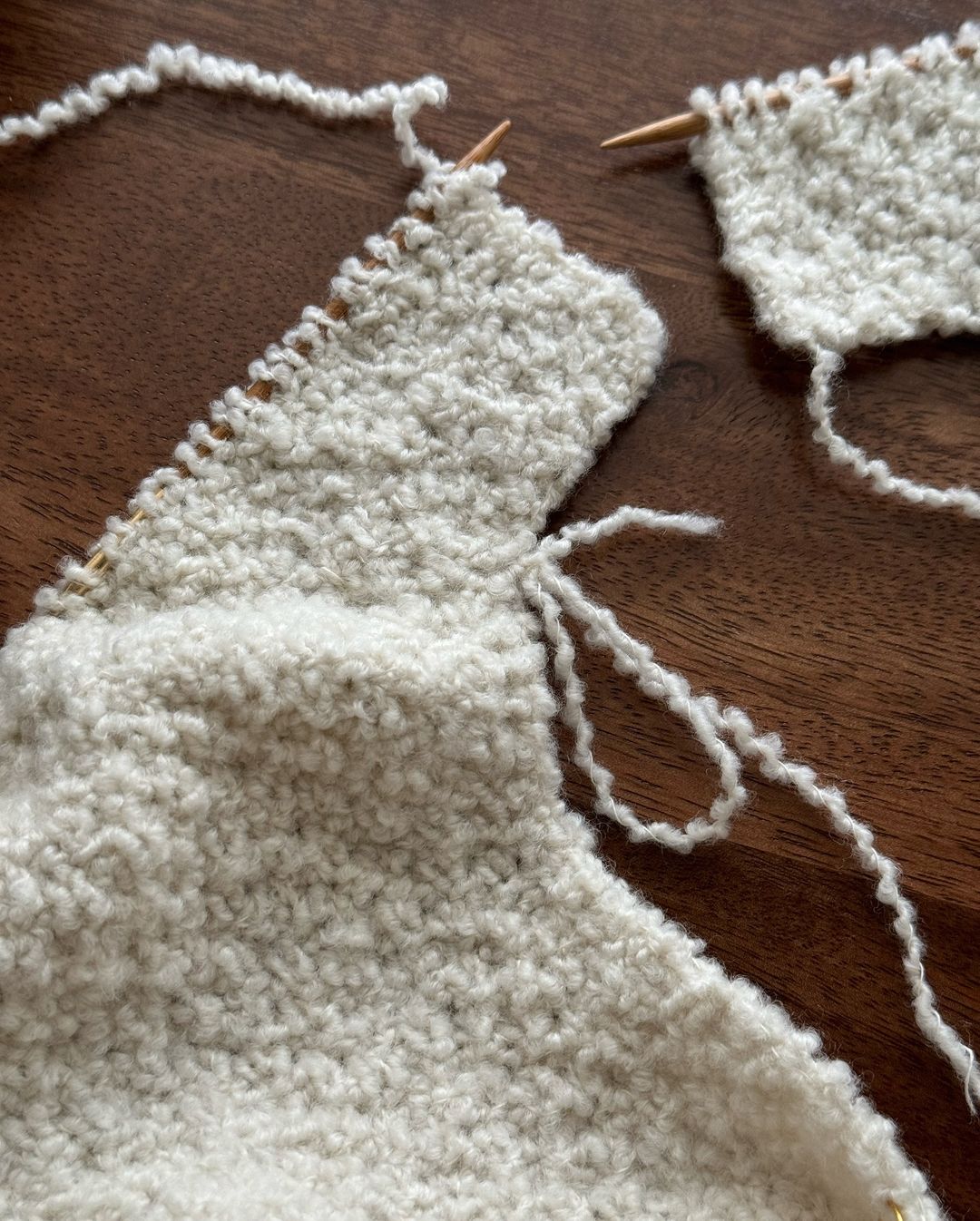 Manon Jacket knitwear pattern with textured moss stitch details.