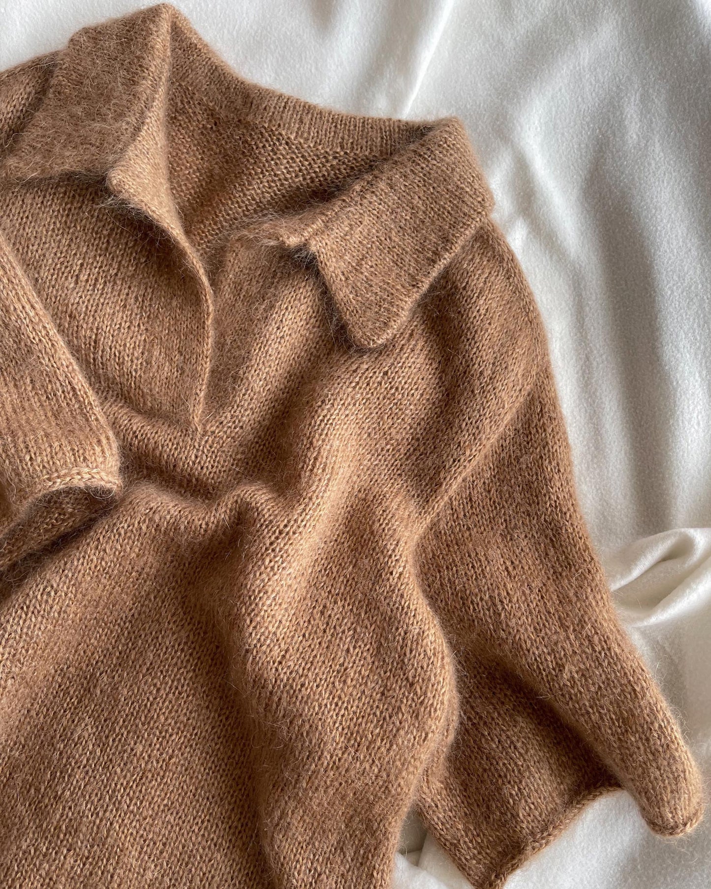 Maren Tee women's knitting pattern by morecaknit with a classic polo collar and elegant button-up design, featuring a relaxed fit and drop shoulders.