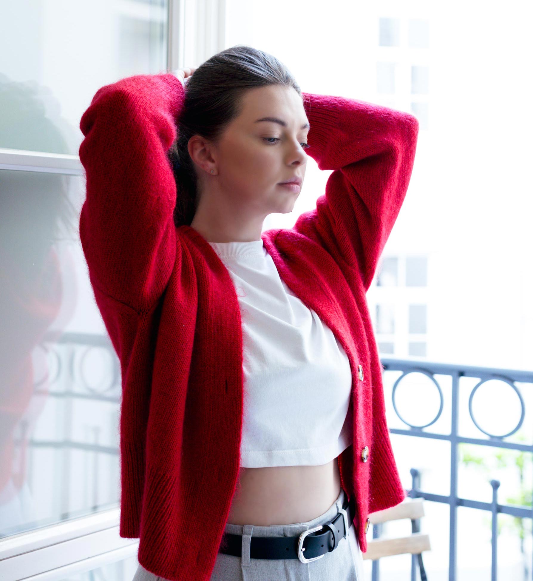 Close-up of the Paul Cardigan's drop shoulders, displaying the pattern's modern aesthetic, knitted in DK 11wpi yarn