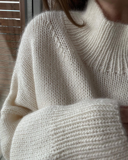 Ness Sweater knitting pattern by MorecaKnit, a warm sweater with long stand-up collar