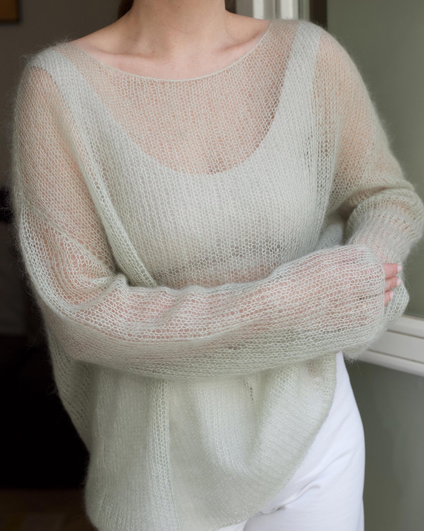 Semi-transparent jumper resembling a web pattern
