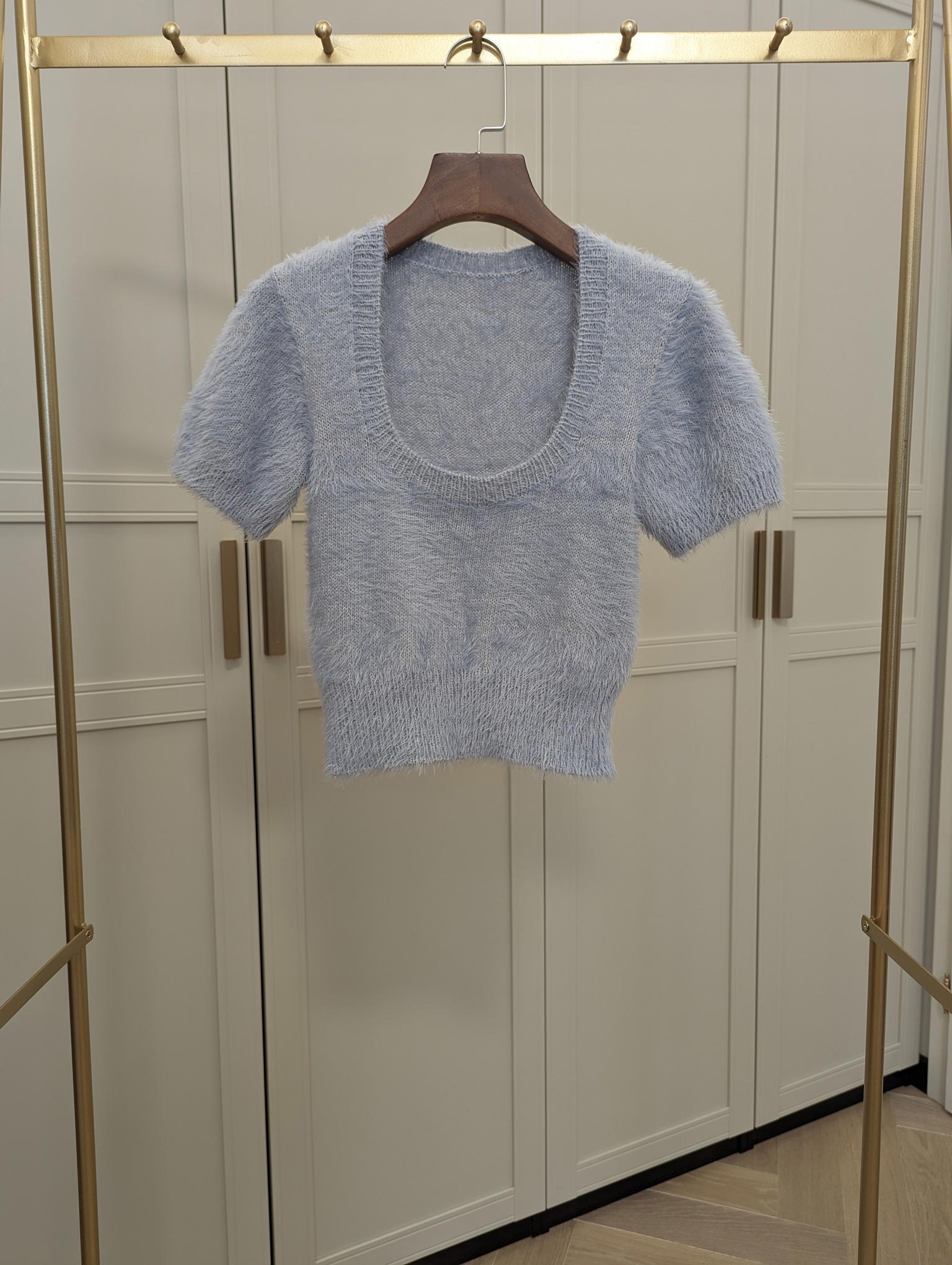 MorecaKnit's Coy Top Closed, a short top knitting pattern with a round closed neckline