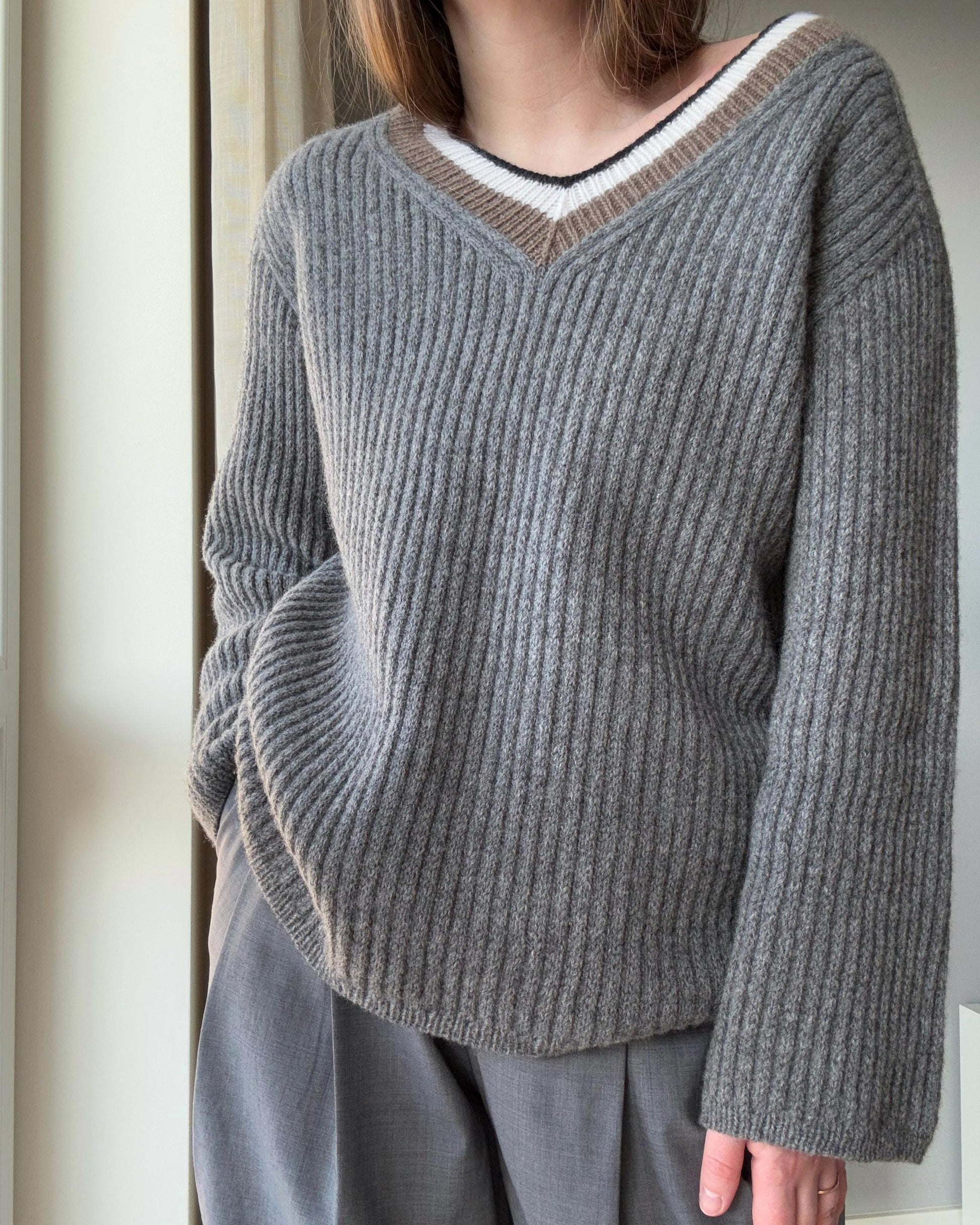 Sophisticated knitting pattern with refined slip stitch and structured design.