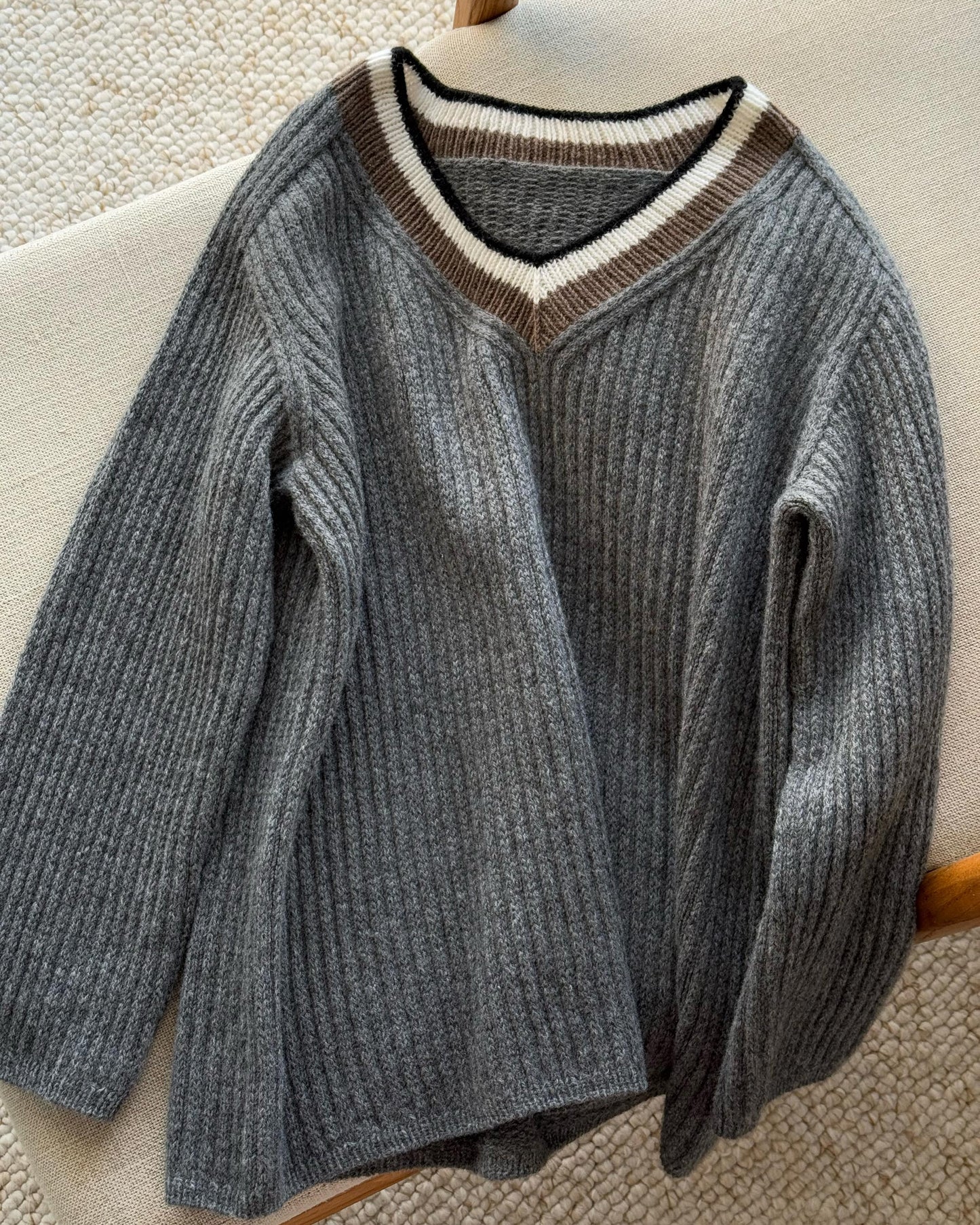 Feminine pullover with advanced V-neck and modern top down knitting technique.