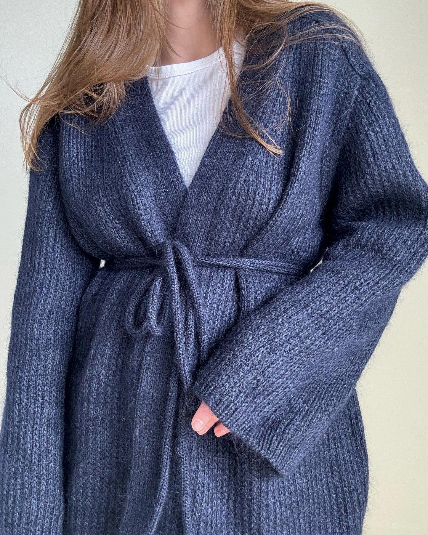 Aesthetic navy blue cardigan pattern with top-down construction.