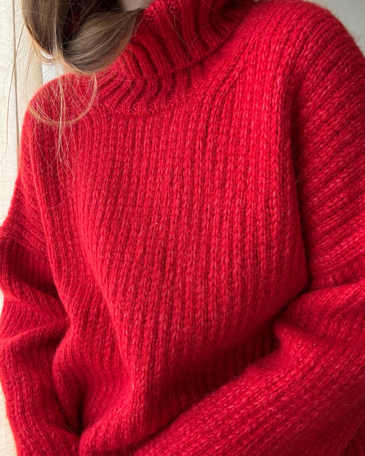 Top-down knitting pattern for warm oversized sweater with drop shoulders