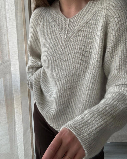 Detailed knitting guide for Chantal Sweater V-neck with modern design elements and top-down construction.