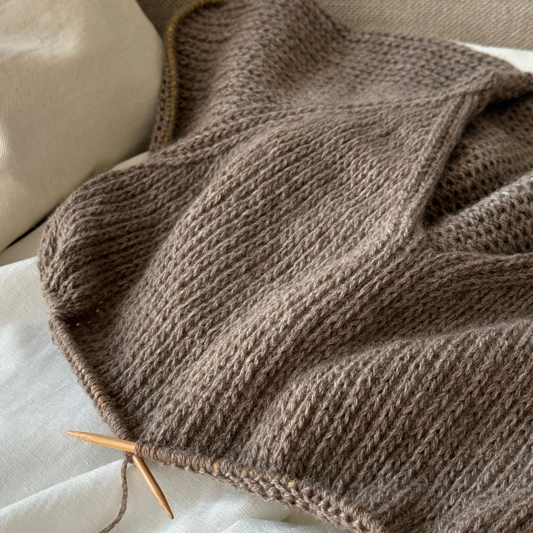 Intermediate knitting pattern for Chantal Sweater V-neck, featuring aesthetic slip stitch and top-down design.