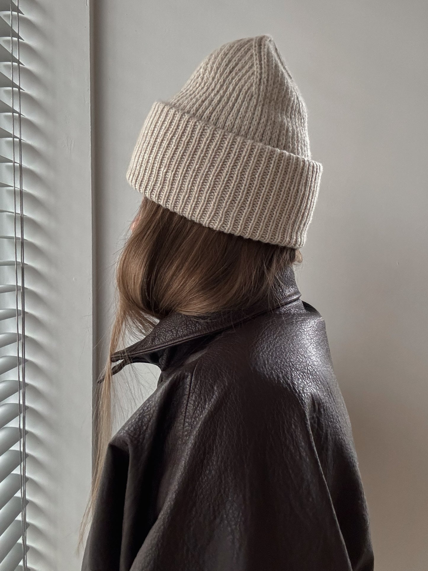 Close view of slip stitch fabric highlighting subtle texture and clean crown shaping.