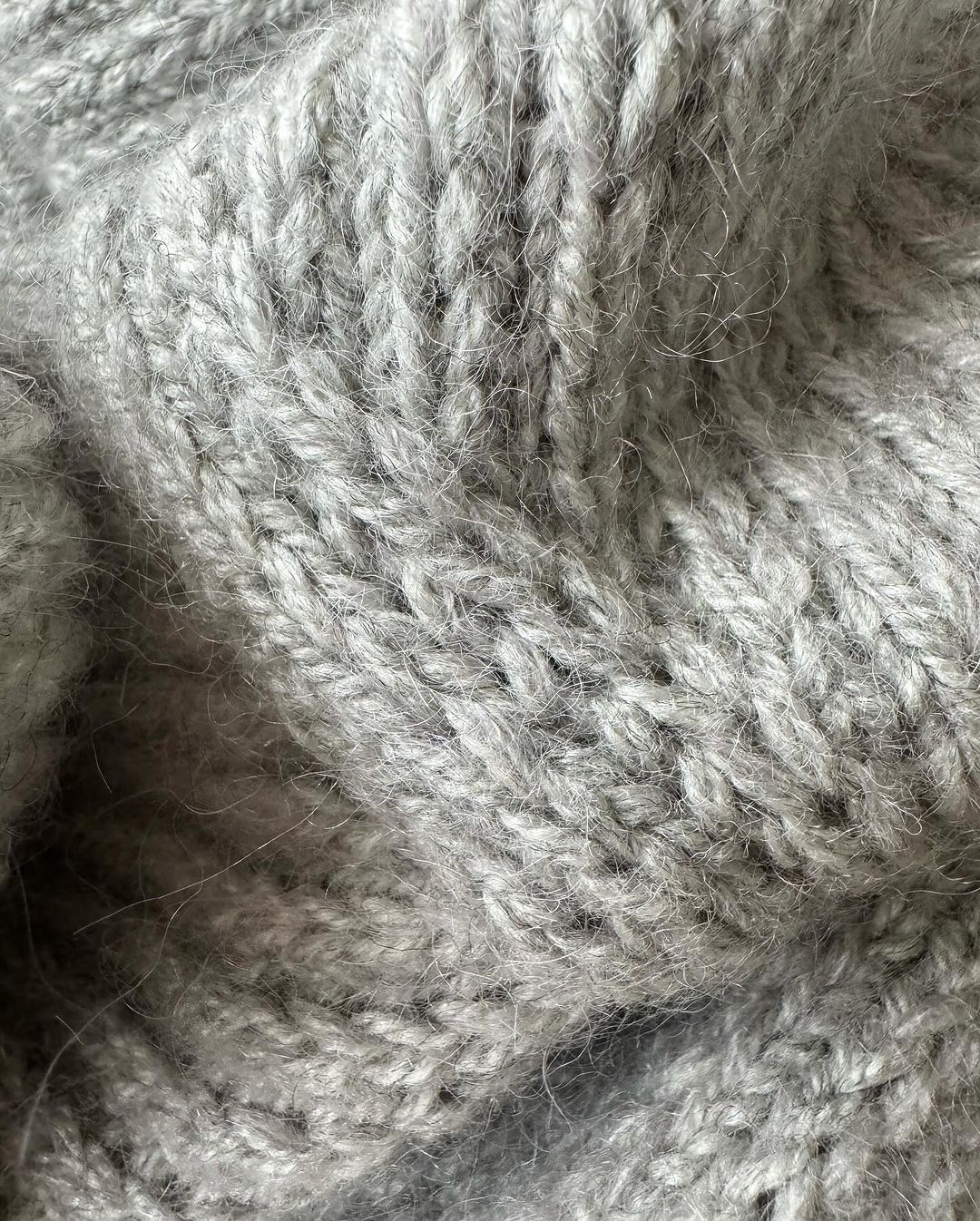 Feminine cardigan knitting pattern for a classic yet modern aesthetic
