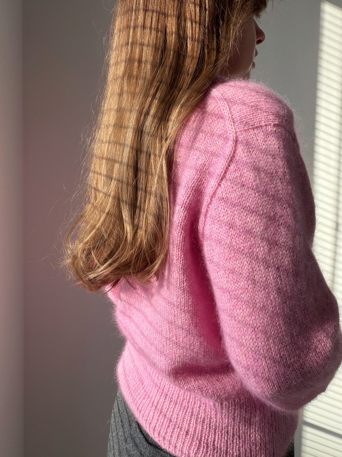 Hem close-up showing slightly cropped length finished with ribbing in the Charlie Cardigan modern cardigan pattern