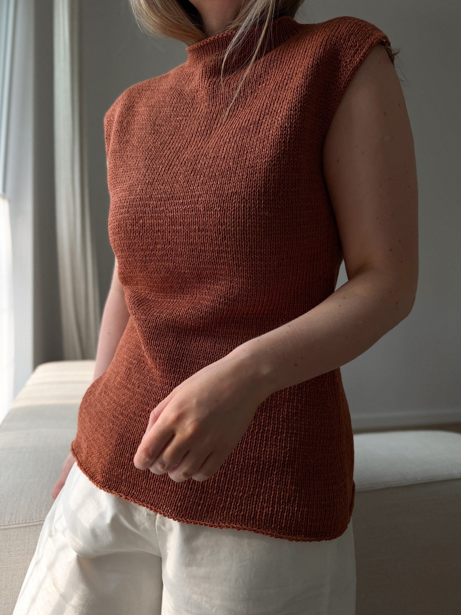 Moreca Knit Gia Top shown in a relaxed Scandinavian style with a refined mock neck silhouette