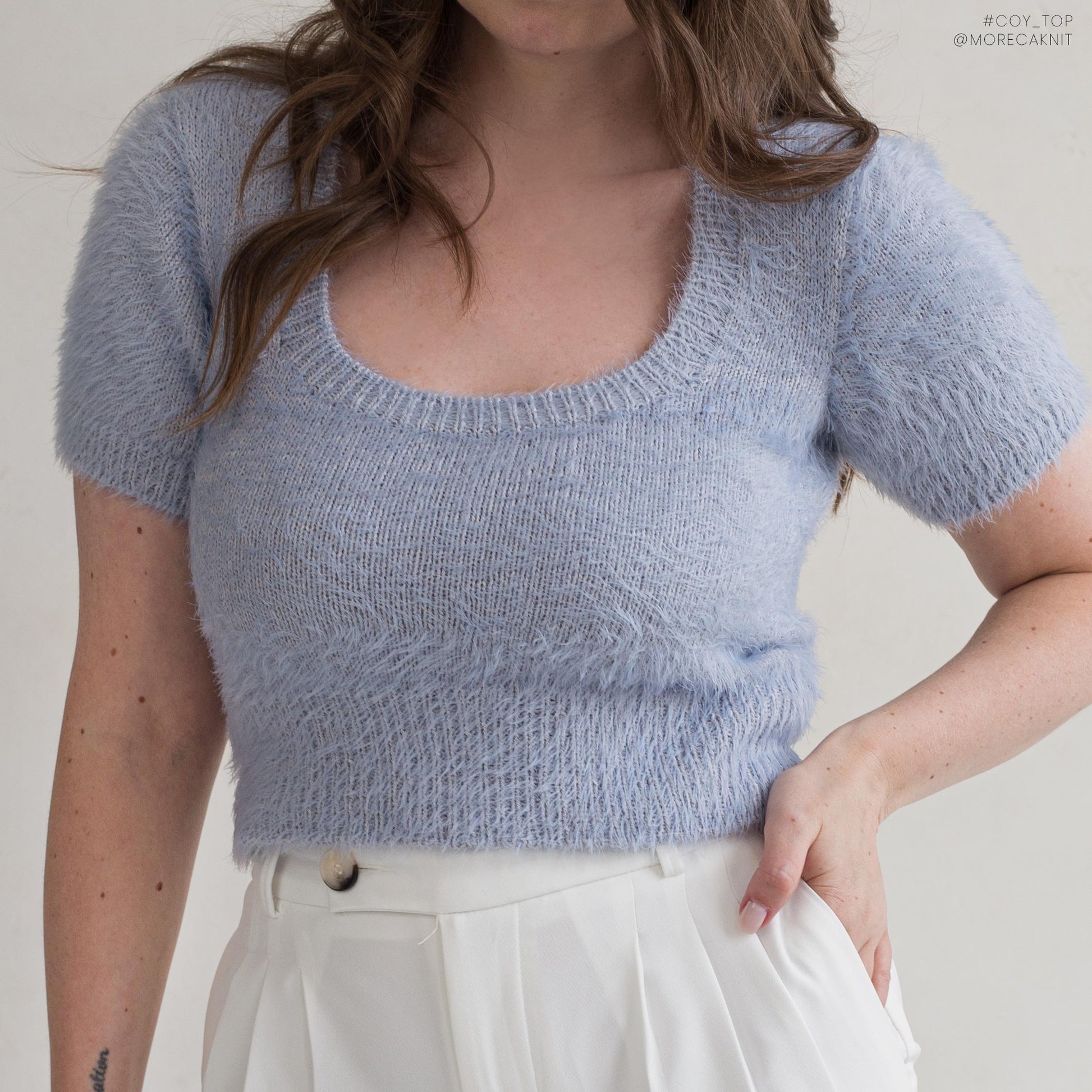 Short-sleeved knitted top with fuzzy texture