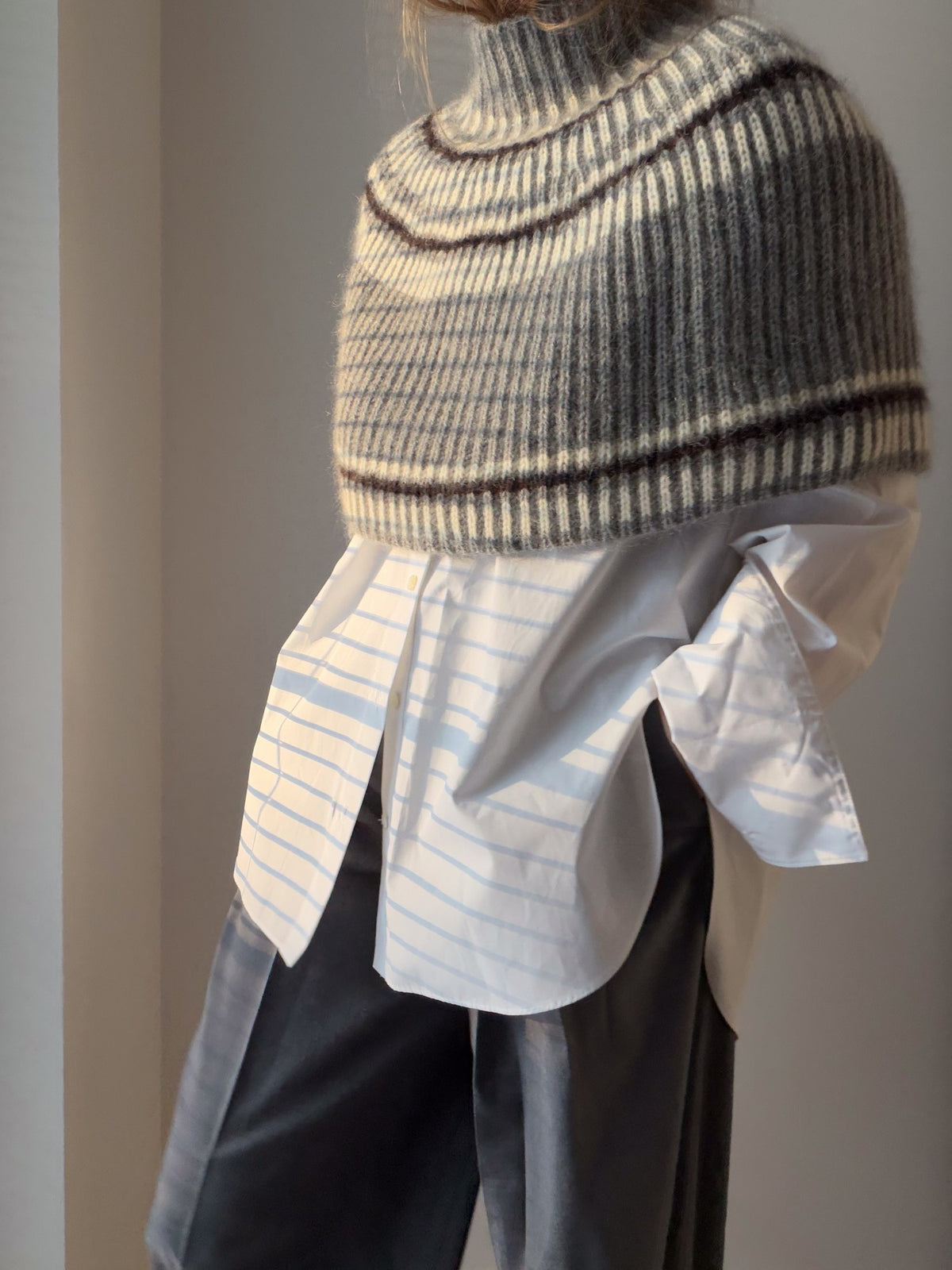 Close view of the lower section showing horizontal stripes and the textured knitted surface.