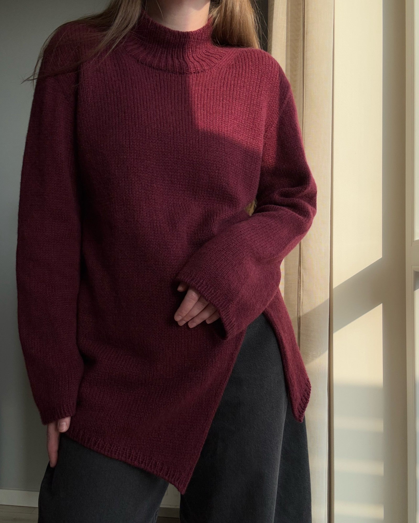Detailed look at the regular fit shaping in a feminine aesthetic sweater pattern.