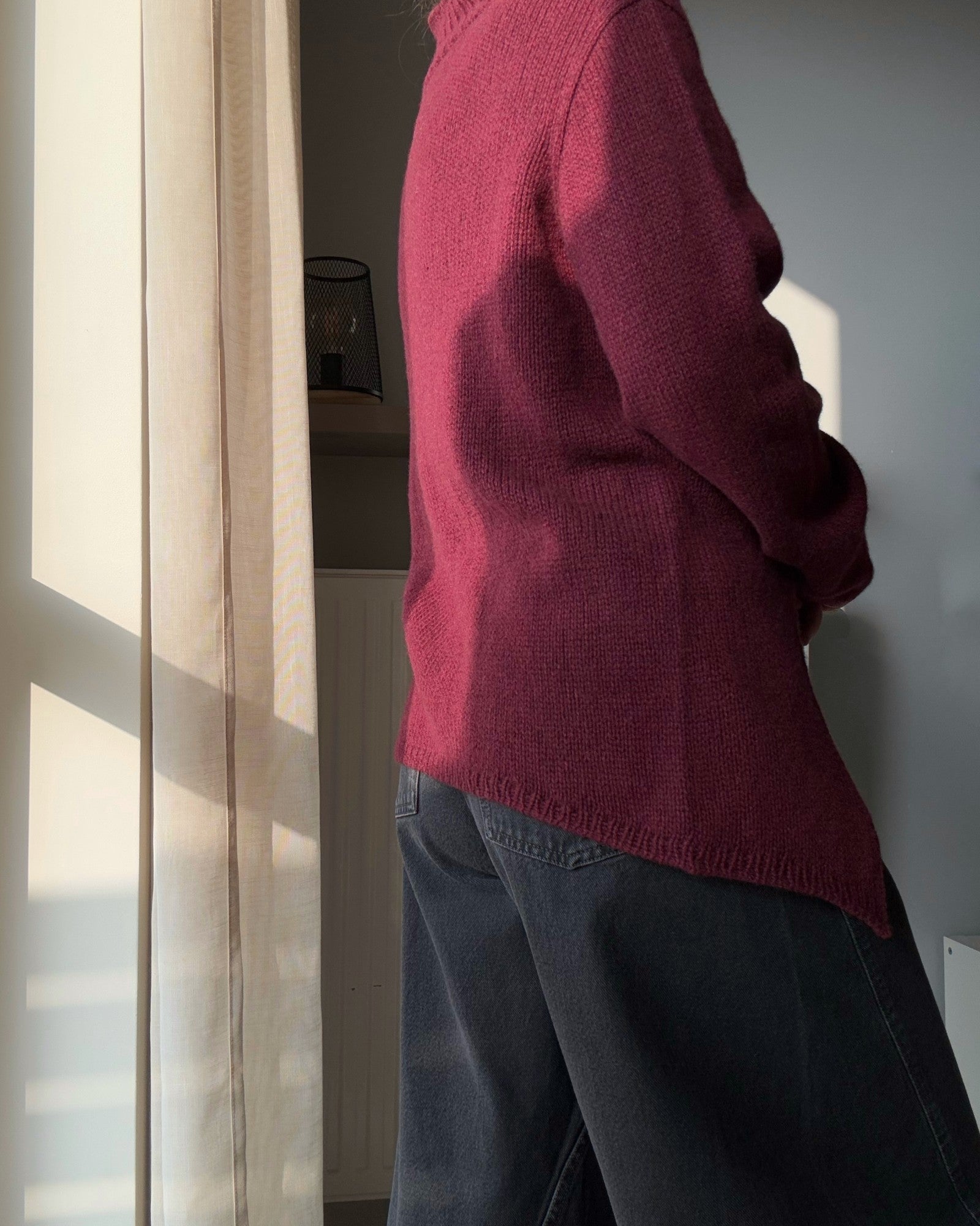 Back view of the mock neck construction made with soft merino or cashmere blend.