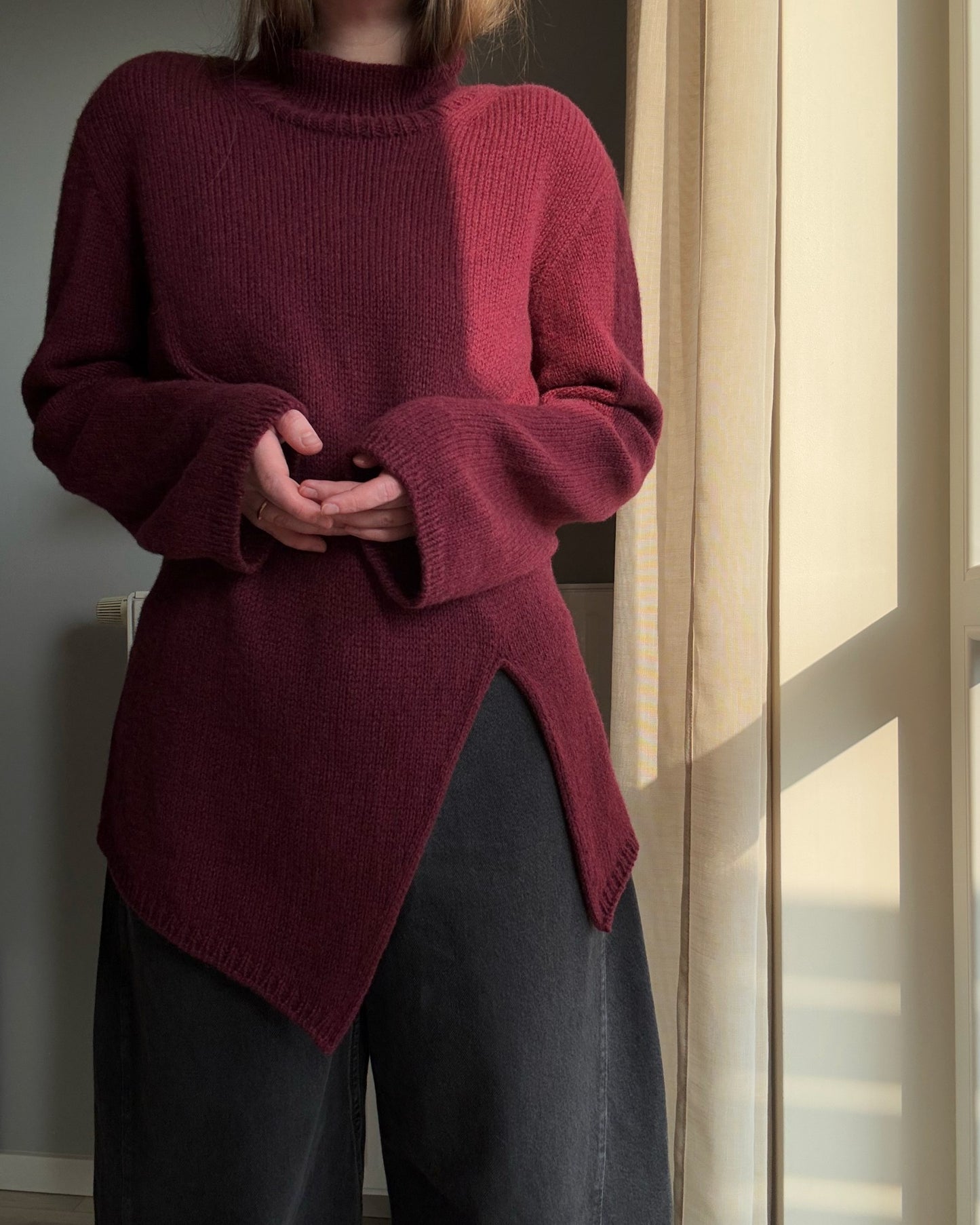 Side profile showing the minimalistic silhouette of this top-down knitting project by Moreca Knit.