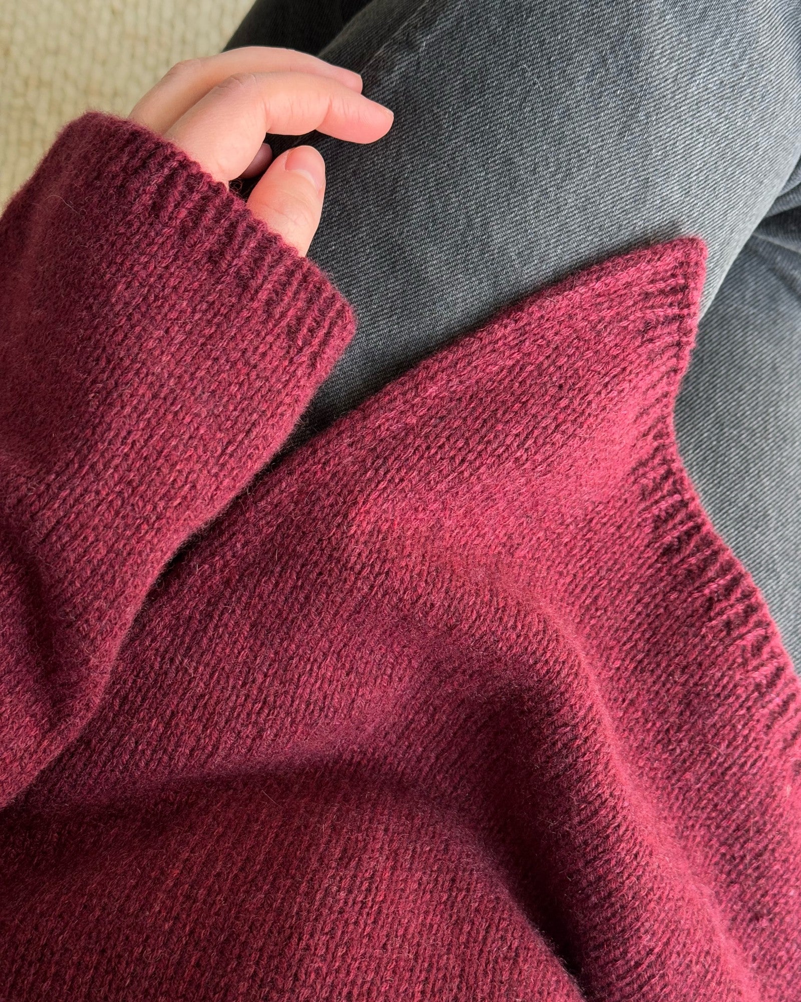 Top-down mock neck sweater created with refined stockinette stitch for a minimalistic aesthetic.