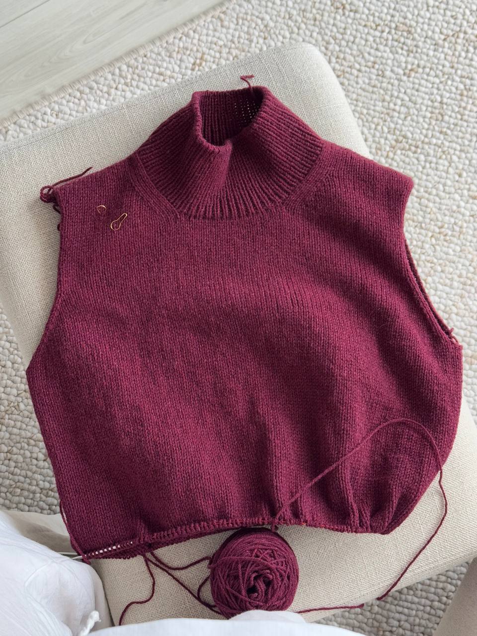 Side profile showing the minimalistic silhouette of this top-down knitting project by Moreca Knit.