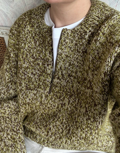 Close look at the zip neck placket and o neck shaping on the knitted pullover