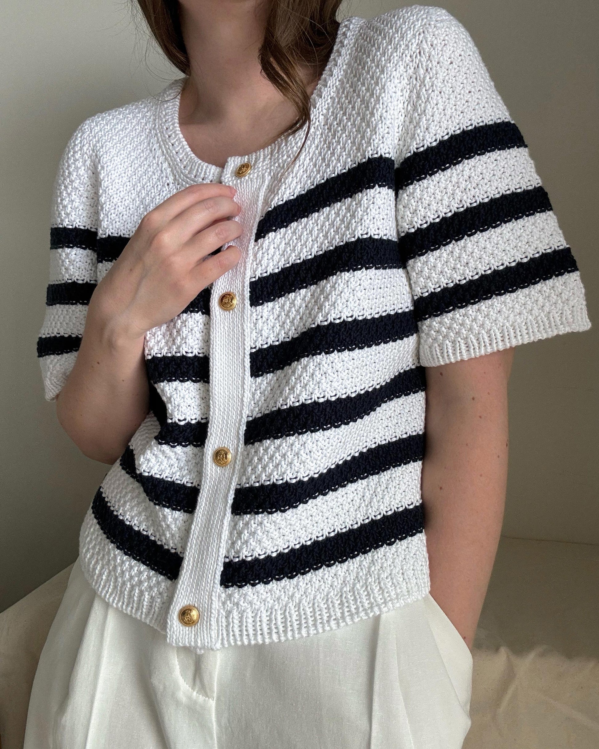 Modern button-up Manon Cardigan in white, perfect for feminine summer style.