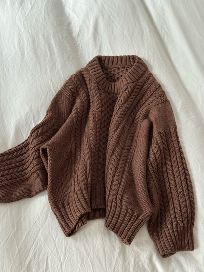 Textured cable sweater knitwear design with classic crewneck and oversized construction