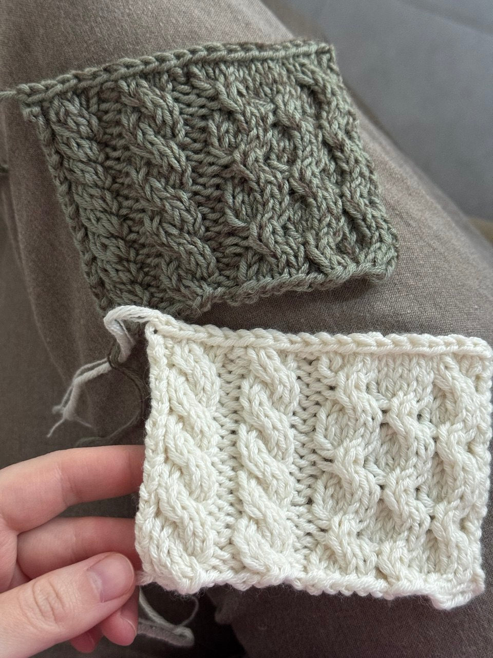 Ninon Sweater pattern displaying cable knitting across the body and sleeves