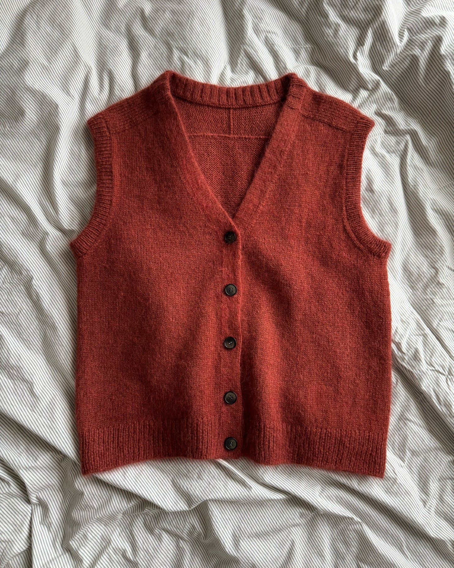 Paul Vest pattern with advanced knitting instructions, featuring a basic, soft, sleeveless cardigan design.